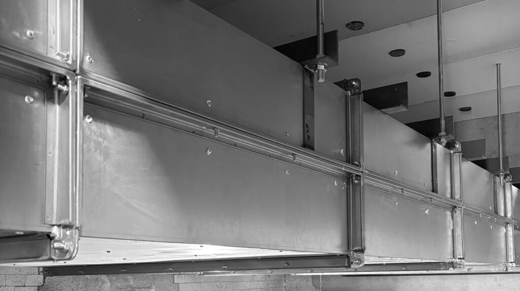 Fire resisting enclosure protecting building services, installed by Fire Specialists Ltd